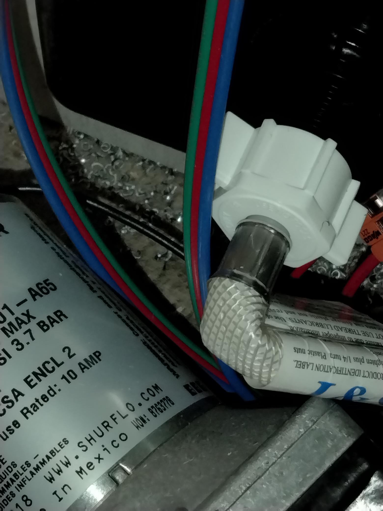 Placeholder frame — RV freshwater plumbing manifold and pump bay awaiting forensic photo